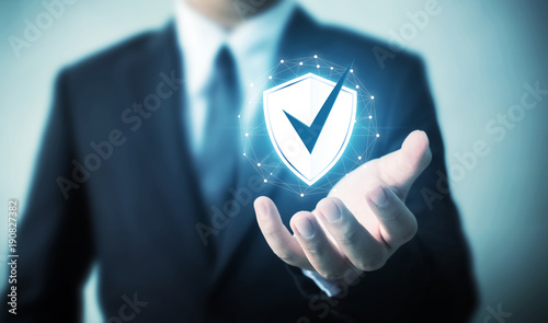 Protection network security computer and safe your data concept, Businessman holding shield protect icon