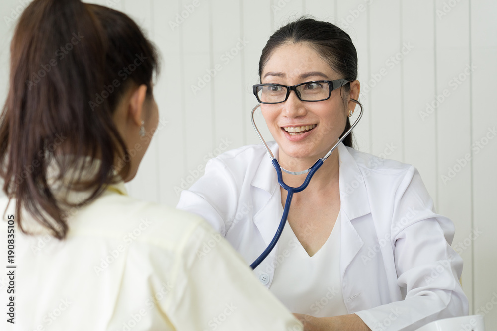 Female doctor meeting with a patient in the office, she is giving a prescription to woman, healthcare and medicine concept.Doctor talking patient . Female doctor meeting with a patient in the office, she is giving a prescription to woman, healthcare and medicine concept.Doctor talking patient .