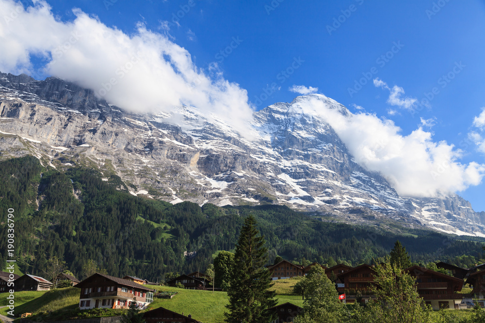 Beautiful summer view of mountain and small village. Beautiful outdoor natural scene in Swiss Alps, Switzerland, Europe.