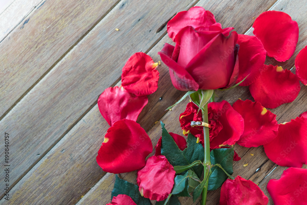 Red rose flower on wooden floor in Valentine's Day Red rose flower on wooden floor in Valentine's Day