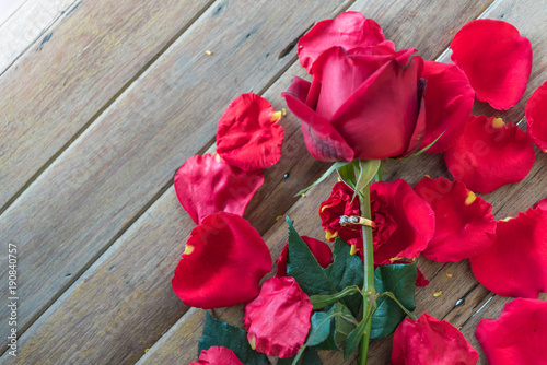 Red rose flower on wooden floor in Valentine s Day