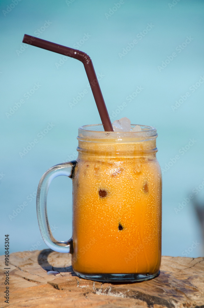 Thai ice tea . ice tea with creamy exotic beverage cools and