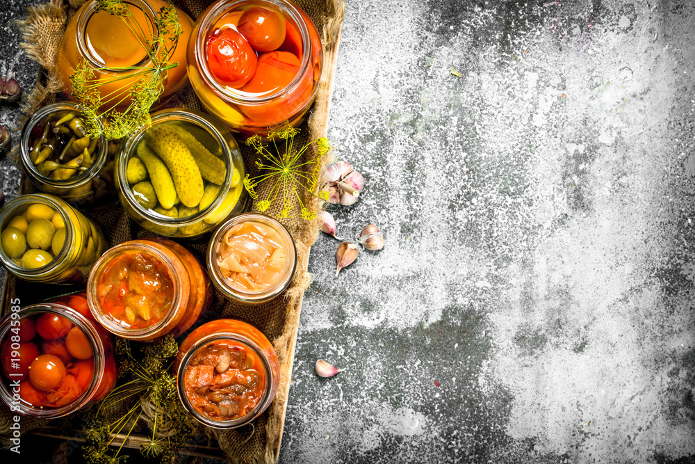 Preserved vegetables with mushrooms on an old tray. Preserved vegetables with mushrooms on an old tray.