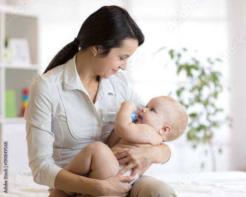 Mother feeding her baby on ...