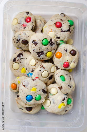 Homemade Cookies with Colorful Chocolate Candies in Food Container