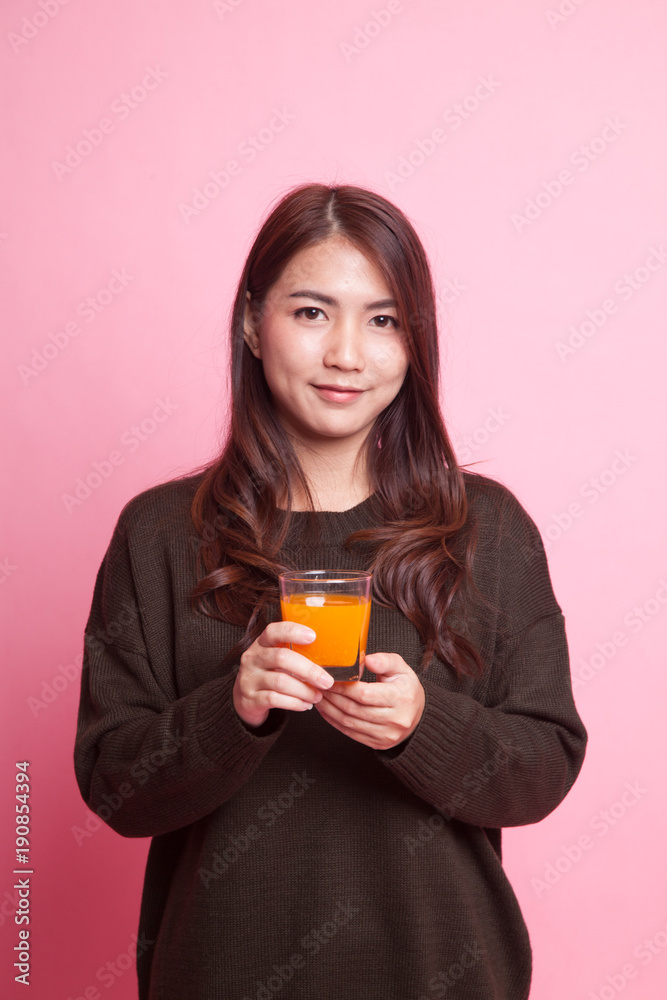 Young Asian woman drink orange juice. Young Asian woman drink orange juice.