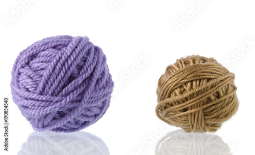 Yarn for handwork and knitting. Set on a white background with reflection.