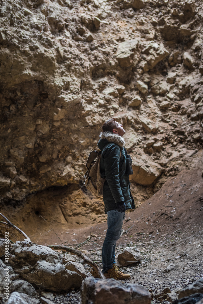 Man traveling with backpack hiking in mountains Man traveling with backpack hiking in mountains