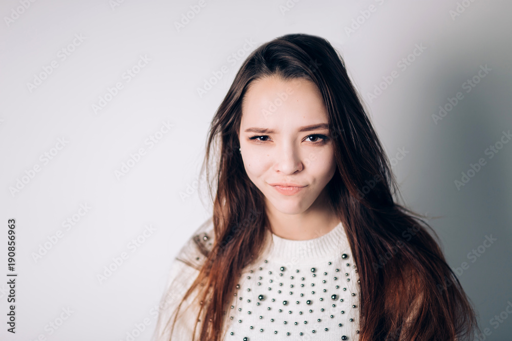 Portrait of funny emotional girl on blue background Portrait of funny emotional girl on blue background