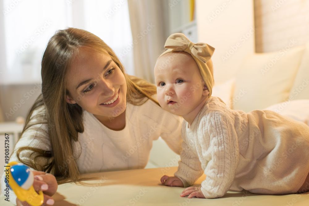 mom and daughter in the room, happy family with the baby