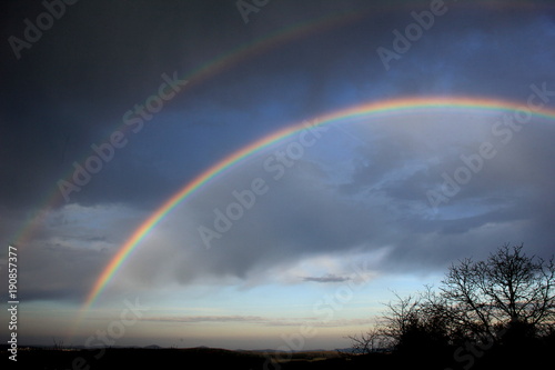 Double rainbow over landscape. Czech Republic.