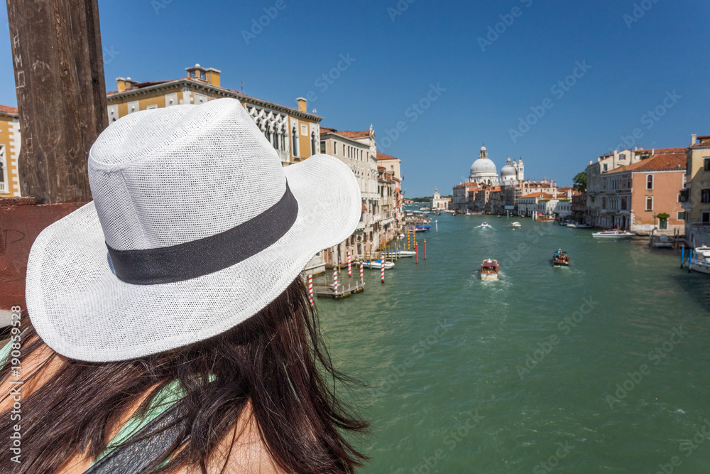 Traveling. Tourist in hat watching the Grand Canal in Venice, Italy