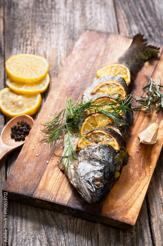 grilled fish with spices and lemon