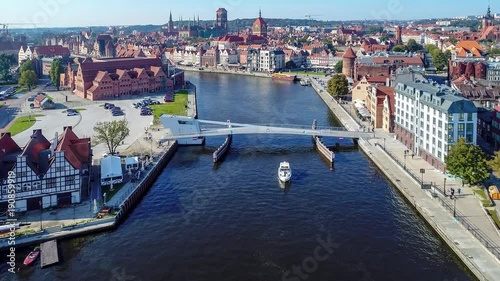 Gdansk, Poland. Aerial  4K video of old old city, Motlawa river, drawbridge and all famous monuments: medieval crane (Zuraw), St Mary, St John churches, city hall tower, old houses,  philharmonic hall