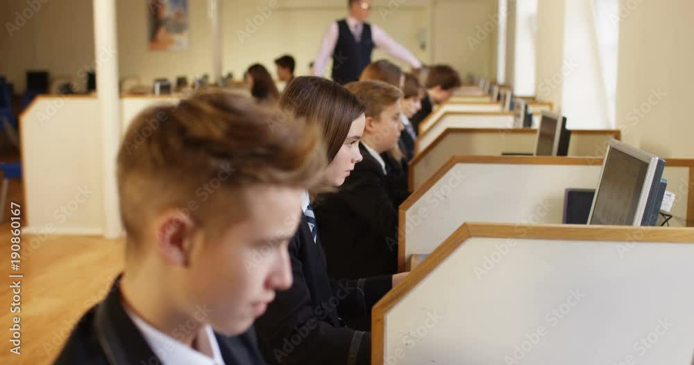 4k, Group of teenage school kids in a computer lab. 4k, Group of teenage school kids in a computer lab.