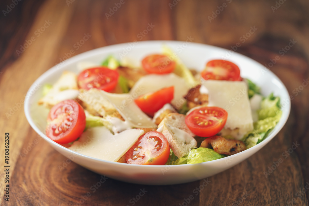 caesar salad with cherry tomatoes closeup caesar salad with cherry tomatoes closeup