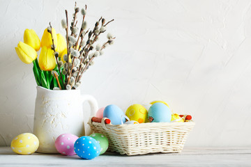 Happy Easter. Congratulatory easter background. Easter eggs and flowers.