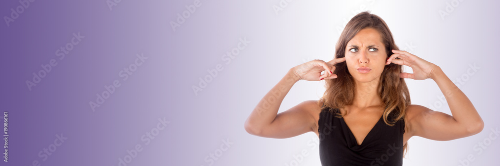 Beautiful girl with her hands covering her ears; isolated photo with copy space Beautiful girl with her hands covering her ears; isolated photo with copy space