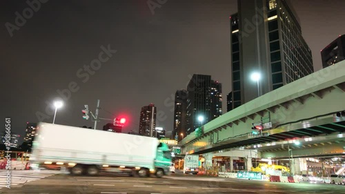 Timelapse of crossing in Tokyo urban street with skyscraper photo