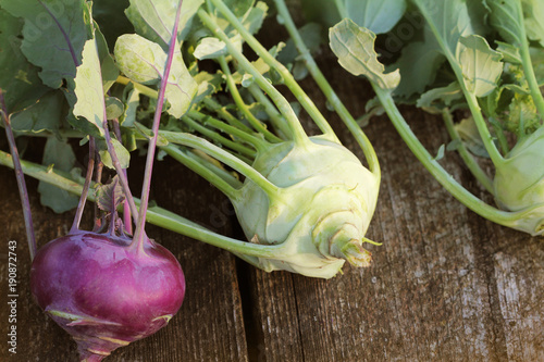 Fresh kohlrabi on the wooden table closeup photo