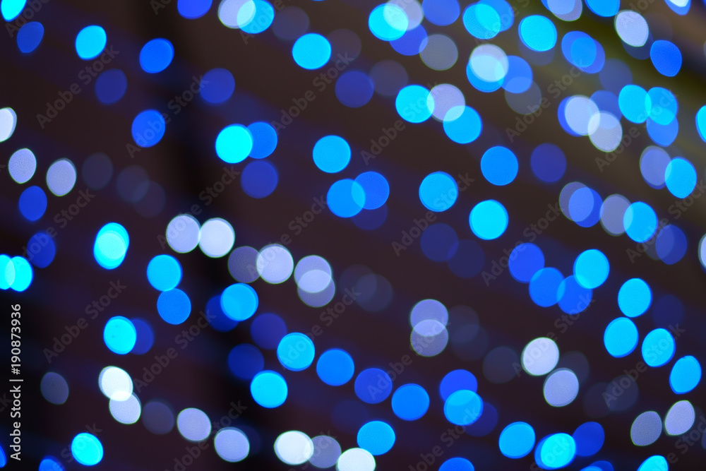 abstract defocused blue bokeh or bubble from light party on black at night for background and christmas festival