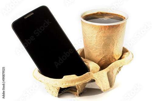 phone and coffee on the stand. concept of Breakfast with coffee and news. isolated photo