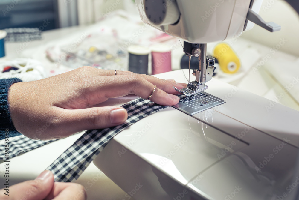 Close up fashion designer tailor clothing with sew equipment.