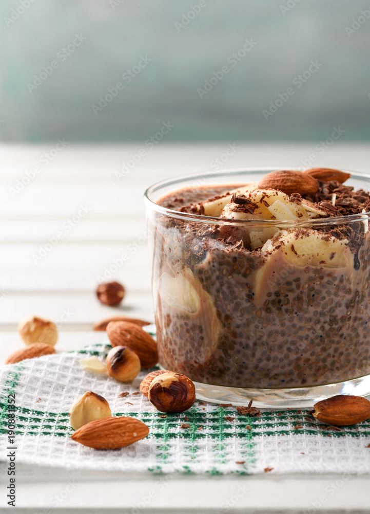 chia pudding with chocolate banana smoothie in a glass jar on the old wooden background chia pudding with chocolate banana smoothie in a glass jar on the old wooden background