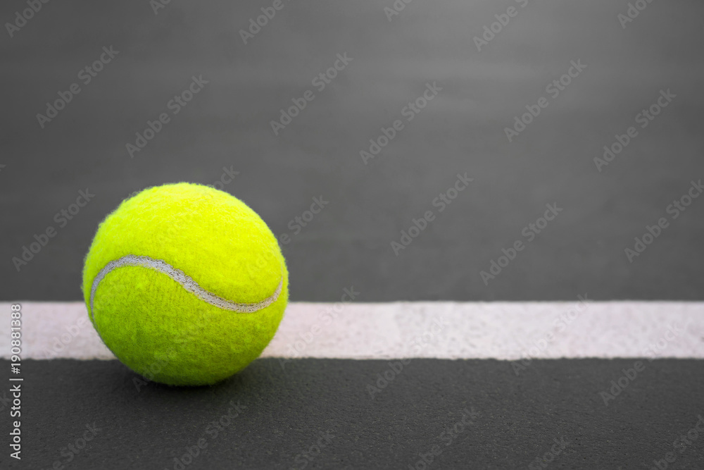 Close up Tennis ball on court background with copy space