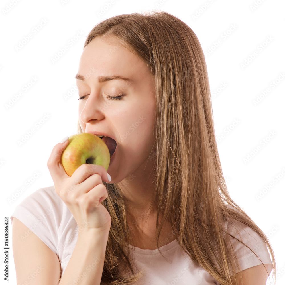Beautiful young smiling woman holding an apple in her hands Beautiful young smiling woman holding an apple in her hands