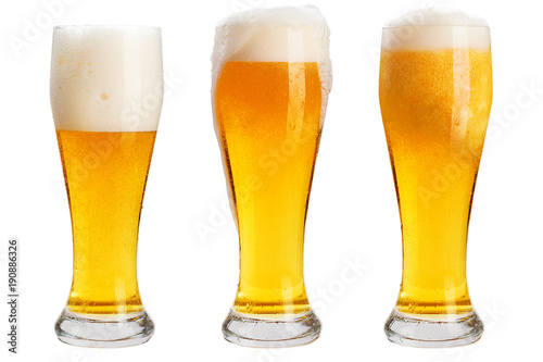 Glass of cold beer with foam, clipping path, bubbles in a drink, on a white background, isolated