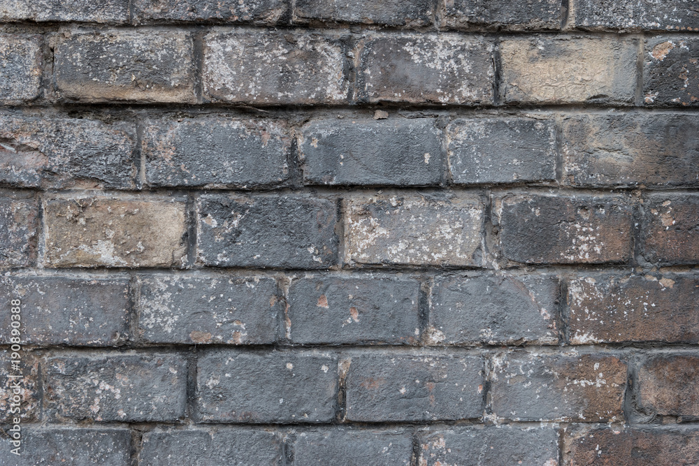 Very old grey brick wall as background or wallpaper. Brick texture and pattern Very old grey brick wall as background or wallpaper. Brick texture and pattern