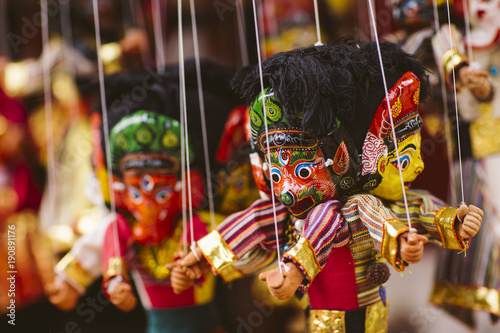 Masks, dolls and souvenirs in street shop in Kathmandu, Nepal.