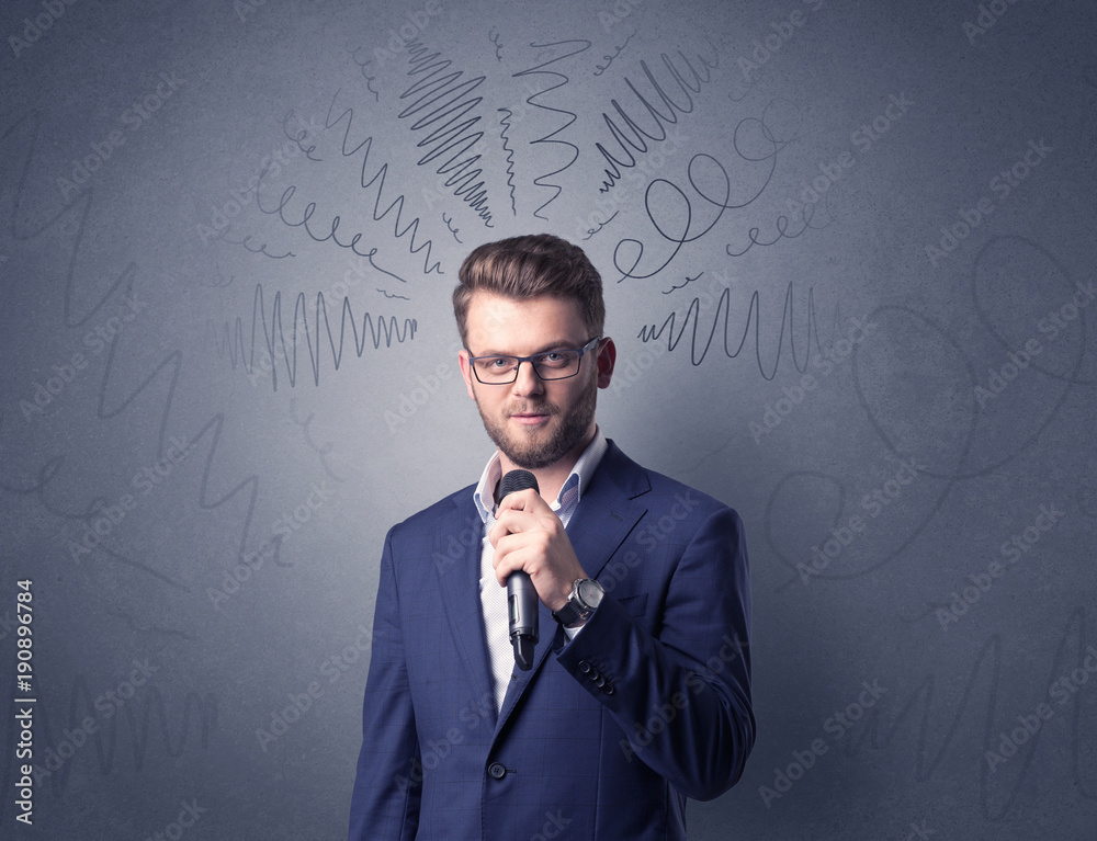 Businessman holding microphone Businessman holding microphone