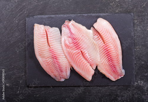 Photography fresh fish fillet on dark board