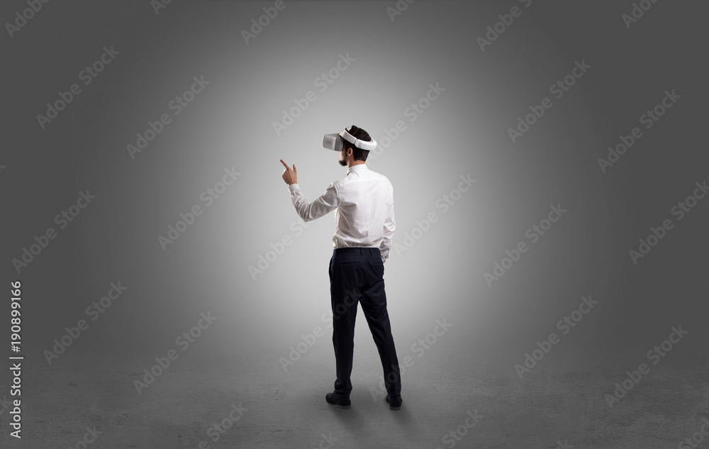 Businessman in an empty room with vr glasses Businessman in an empty room with vr glasses