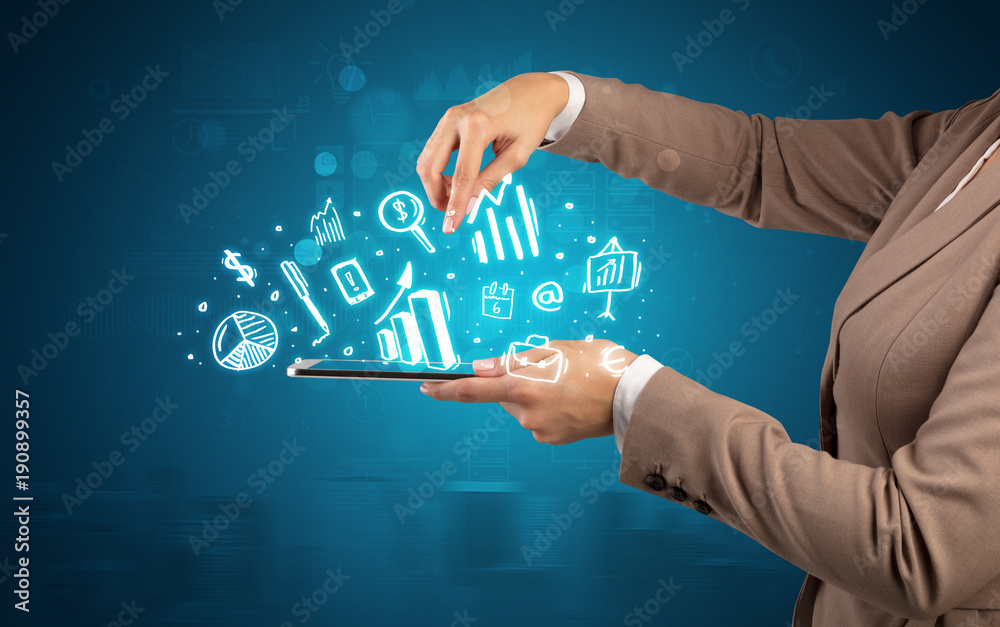 Hand holding tablet with chalk drawn symbols above Hand holding tablet with chalk drawn symbols above