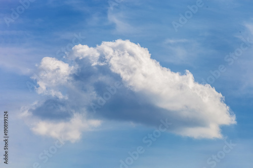 Lonely white cloud in blue sky