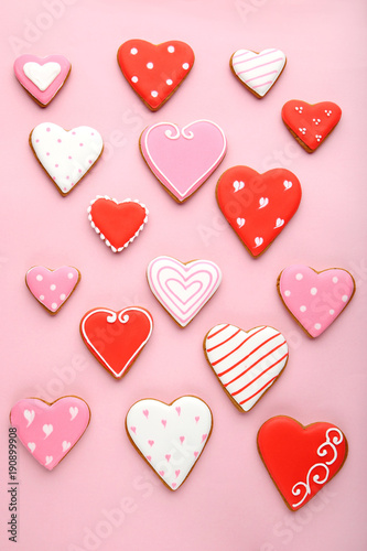Homemade valentine cookies on pink background