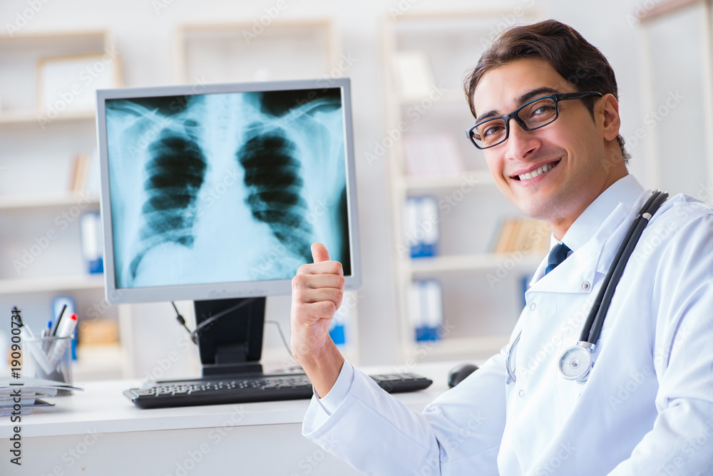 Doctor radiologist looking at x-ray images Doctor radiologist looking at x-ray images