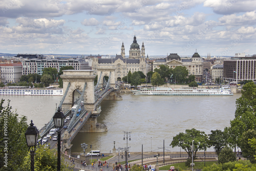 Chain Bridge over the Danube River in Budapest with St Stephen Basilica behind.