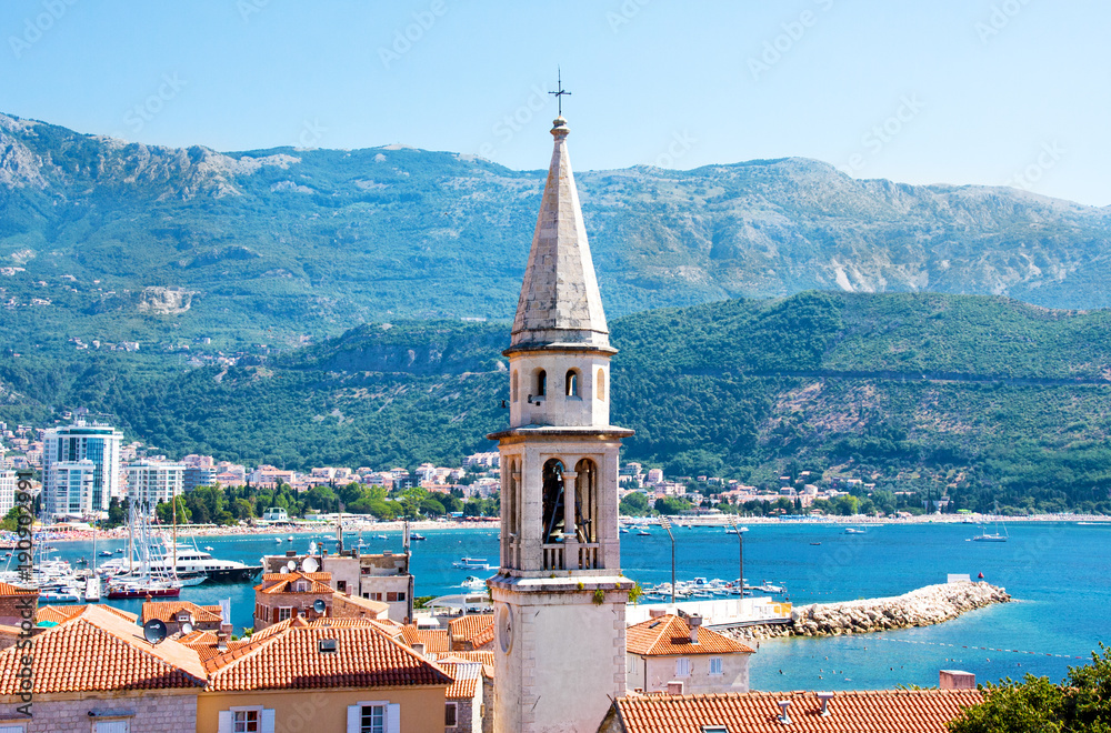 View of Church of St Ivan, Budva old town, mountains and sea. Montenegro