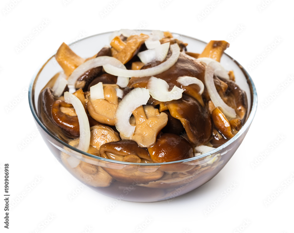 Pickled mushrooms in a glass bowl