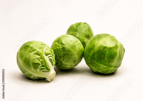 Closeup of Four Fresh Green Brussels Sprouts