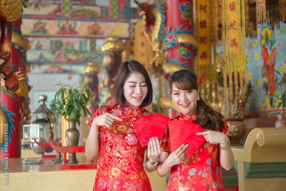Portrait of beautiful asian woman in Cheongsam dress,Thailand people,Happy Chinese new year concept