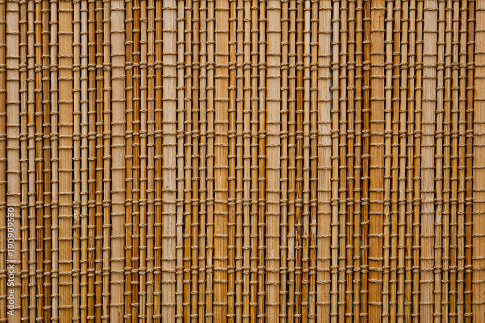 The texture of the bamboo mat of light shade filling the whole frame The texture of the bamboo mat of light shade filling the whole frame