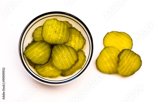 Closeup of a Bowl of Green Sliced Pickles