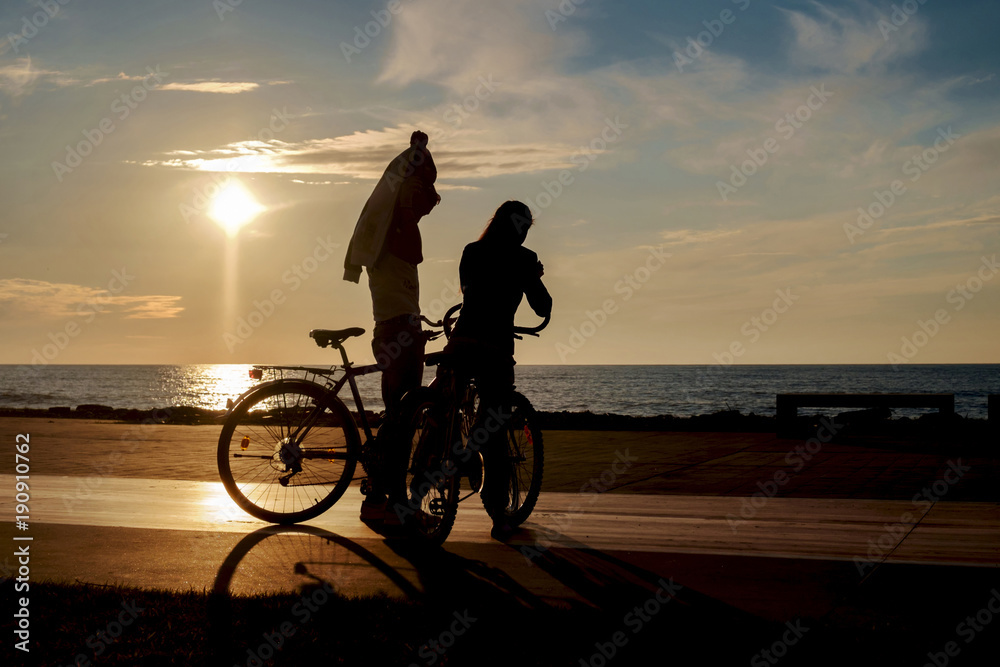 Fototapeta premium Two bikers taking a break on the sunny beach