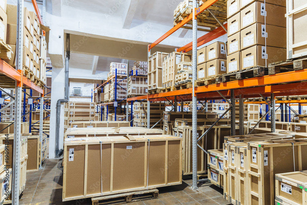 Logistic, industry, shipment, storage and manufacturing concept. Cargo  boxes on shelves in warehouse. Industrial goods. Large long racks.  Stock-Foto | Adobe Stock