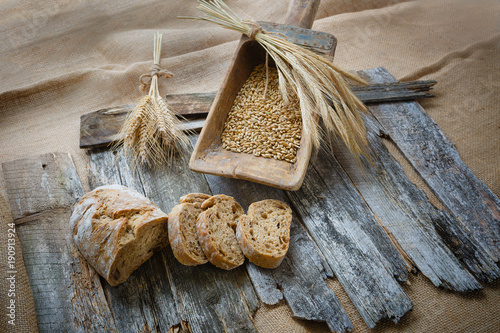 Fresh bread ciabatta and rye on the wooden board photo